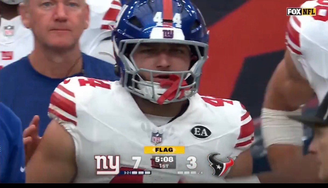 Cam Skattebo wearing Giants No. 44 on the sideline during the FOX NFL broadcast of the Houston game